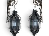 pair of antique iron wall sconces with glass panels