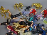 a lot of toy figurines that are laying on a table