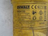 yellow gas can with a label on it sitting on a white surface