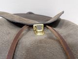 a close up of a brown bag with a gold buckle