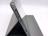 a close up of a laptop on a white surface