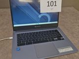 a laptop that is sitting on a table with a price tag on it