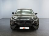 the front view of a black car in a showroom