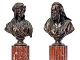 pair of bronze busts of a man and a woman on marble bases