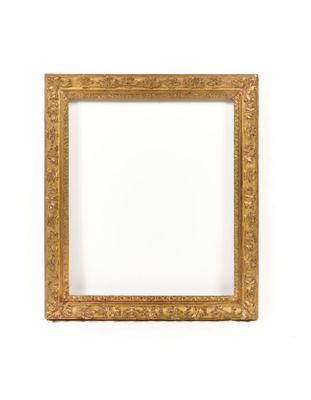 a gold frame on a white wall with a white background