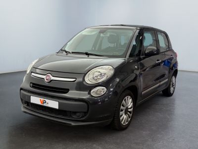 the small black car is parked in a large room