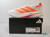 the adidas shoes are on top of a box on a white surface