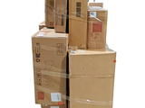 many boxes stacked on top of each other on a pallet