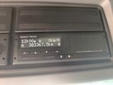 a radio in the center of a car with a clock on it