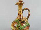 an image of a vase with a handle on a white background
