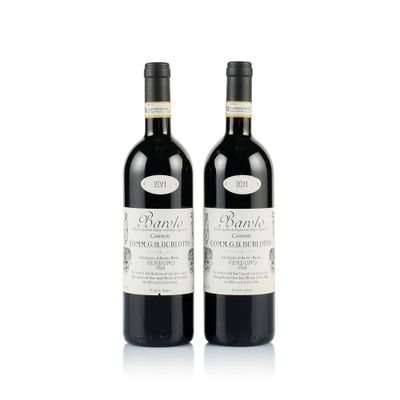 two bottles of wine sitting next to each other on a white surface