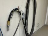 two hoses attached to the wall next to each other