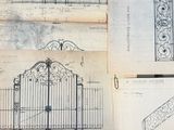 a lot of drawings of a gate on a table