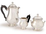 three pieces of silver tea and coffee set on a white background