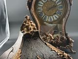 a clock that is sitting on a table next to a mirror