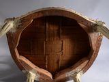 a wooden barrel that has two legs on it