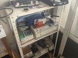 a shelf that has a bunch of electronics on it