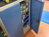 an image of a small cabinet with tools in it