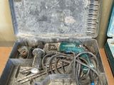 a metal case with tools in it sitting on a table