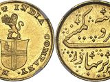 a gold coin with an image of a lion on top of it