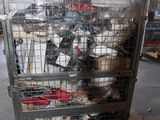 a cage filled with lots of stuffed animals inside of it
