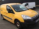 a yellow van that is parked in a parking lot