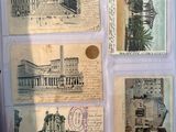 several old postcards are displayed on a piece of paper