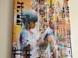 un tableau représentant un garçon en train de lire un livre, accroché au mur