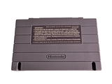 a gray nintendo game console sitting on a white surface