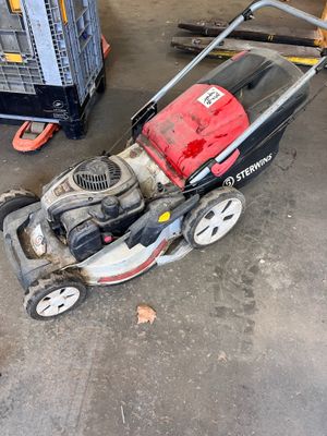 an image of a lawn mower sitting in a garage