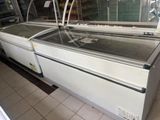 two refrigerated refrigerates in a store