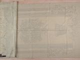 a piece of cloth that has been stitched together on a table
