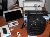 a printer and other electronics sitting on a desk next to a laptop