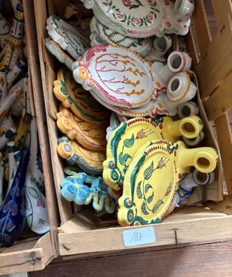 a box full of teapots and other decorative items