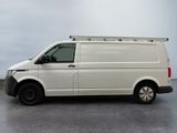the white van is parked on the concrete floor in the room
