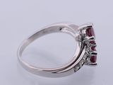 a close up of a ring on a white surface