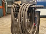 a machine that is sitting on the floor with hoses