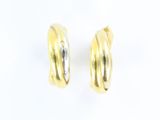 two tone gold hoop earrings on a white background