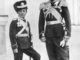 black and white photo of two men in uniforms standing next to each other
