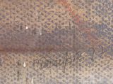 a close up of a metal object with writing on it