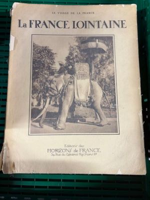 a picture of a book with a picture of a man riding an elephant