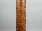 an image of a tall wooden lamp on a table