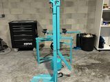 an image of a blue machine in a garage
