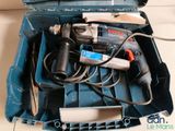 a blue tool box with tools in it on the floor