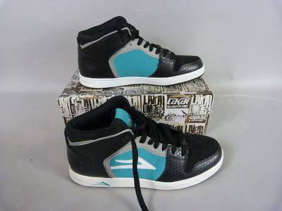 black and teal high top sneakers with blue accents on top of a box