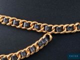 gold and black leather chain belt with a black leather buckle