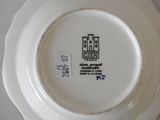 a white plate with a picture of a castle on it