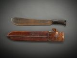 two knives are sitting next to each other on a table