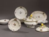 a lot of plates and bowls that are sitting on a table