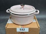 a white pot sitting on top of a cardboard box